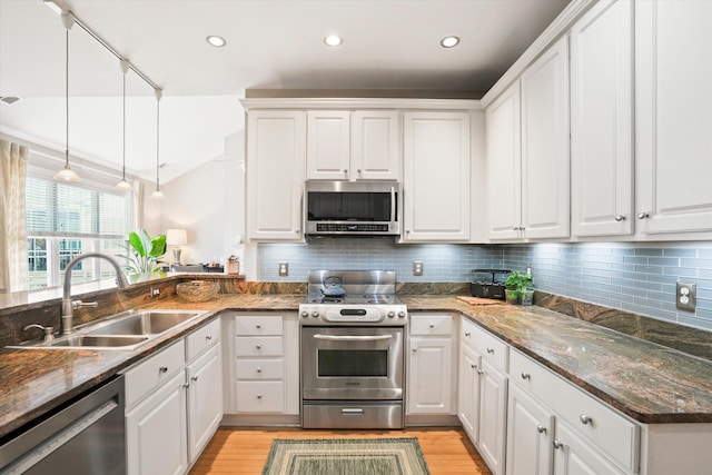 3526 Stockton Dr, Mount Pleasant, SC 29466 - kitchen with light wood-style flooring, white cabinetry, a sink, and appliances with stainless steel finishes