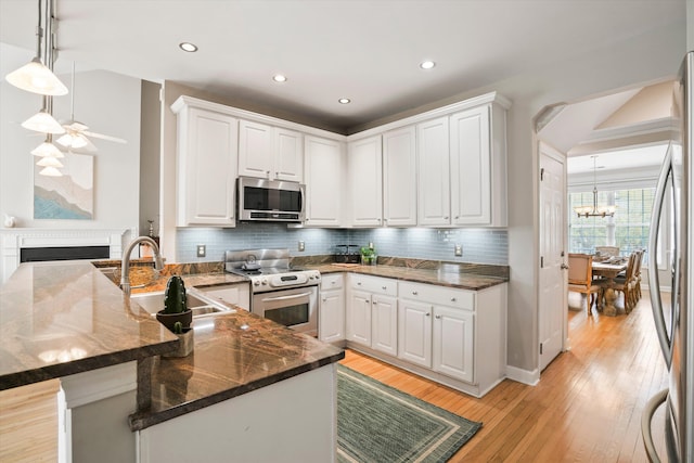 3526 Stockton Dr, Mount Pleasant, SC 29466 - kitchen featuring a sink, appliances with stainless steel finishes, and white cabinetry