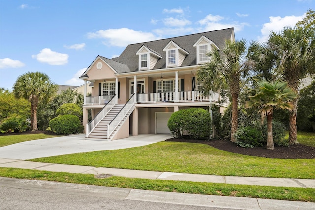 3526 Stockton Dr, Mount Pleasant, SC 29466 - raised beach house with a front lawn, driveway, a porch, a garage, and stairs
