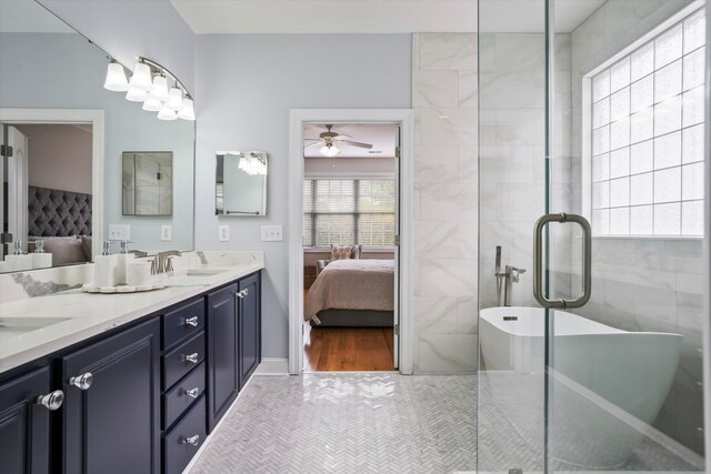 3526 Stockton Dr, Mount Pleasant, SC 29466 - bathroom featuring double vanity, a soaking tub, a ceiling fan, connected bathroom, and a sink