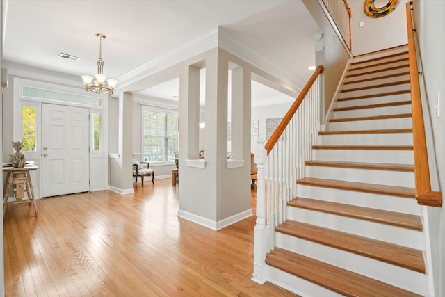 3526 Stockton Dr, Mount Pleasant, SC 29466 - foyer with visible vents, baseboards, light wood-type flooring, crown molding, and stairs