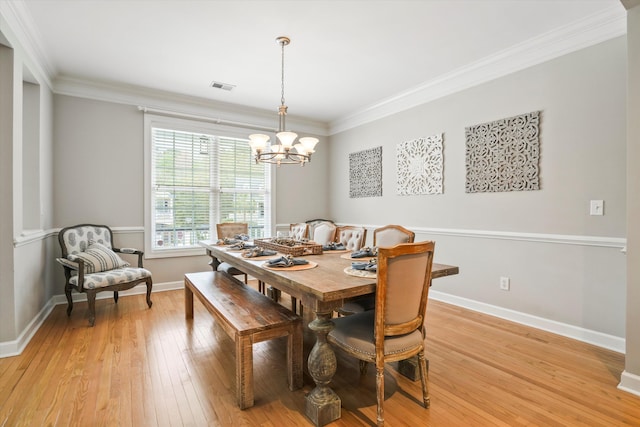 3526 Stockton Dr, Mount Pleasant, SC 29466 - dining area with visible vents, baseboards, ornamental molding, a chandelier, and light wood finished floors