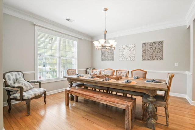 3526 Stockton Dr, Mount Pleasant, SC 29466 - dining area with an inviting chandelier, light wood-style flooring, ornamental molding, visible vents, and baseboards