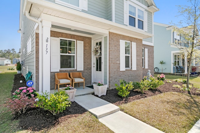 view of exterior entry featuring a porch