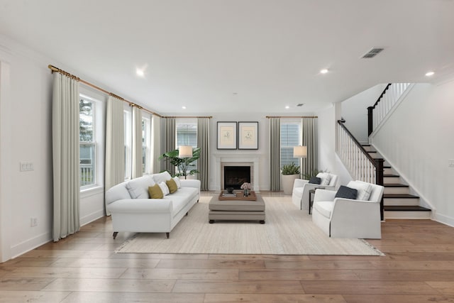 living room with light hardwood / wood-style flooring