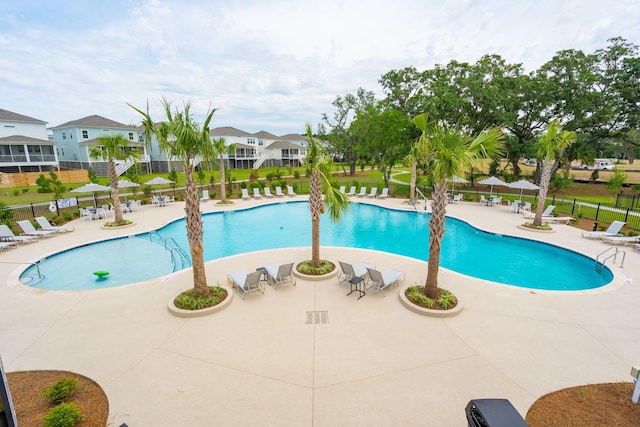 view of pool featuring a patio