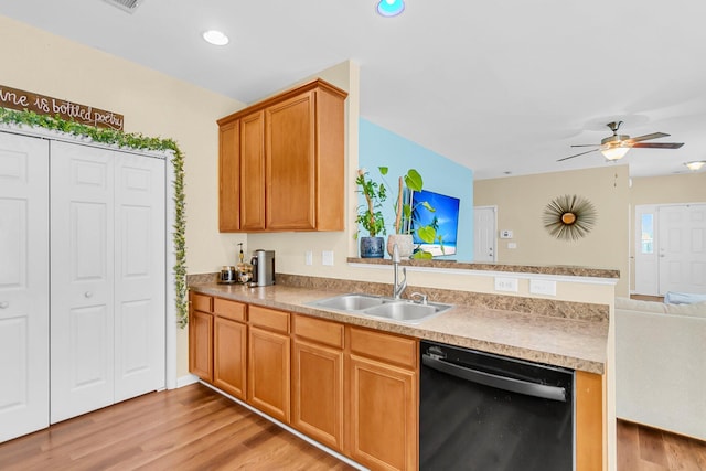 252 Island Green Rd, Goose Creek, SC 29445 - kitchen featuring dishwasher, a sink, a peninsula, open floor plan, and light wood-type flooring