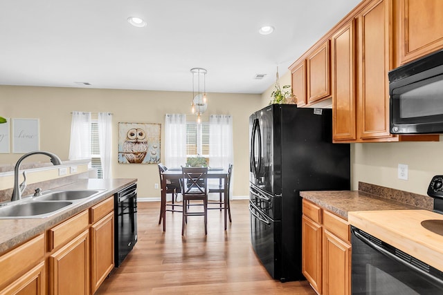 252 Island Green Rd, Goose Creek, SC 29445 - kitchen featuring a sink, black appliances, light wood-style floors, recessed lighting, and pendant lighting