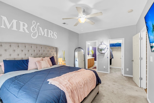 252 Island Green Rd, Goose Creek, SC 29445 - bedroom featuring light colored carpet, baseboards, a walk in closet, a ceiling fan, and connected bathroom