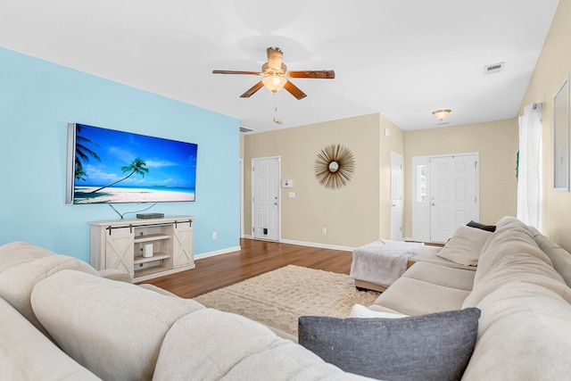 252 Island Green Rd, Goose Creek, SC 29445 - living room featuring wood finished floors, ceiling fan, and baseboards