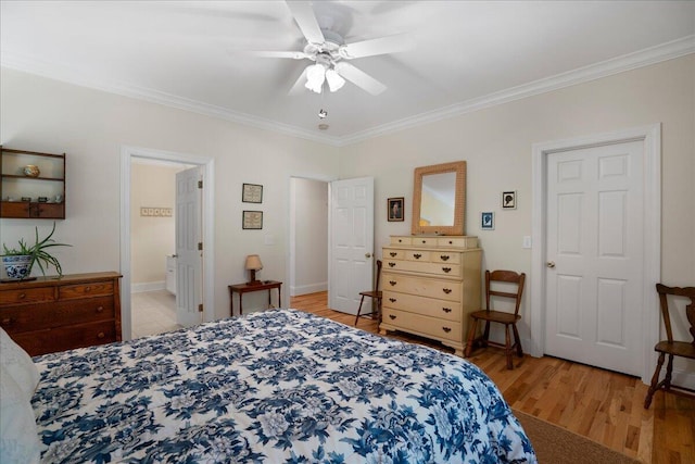 bedroom featuring ceiling fan, ensuite bathroom, crown molding, and light hardwood / wood-style floors