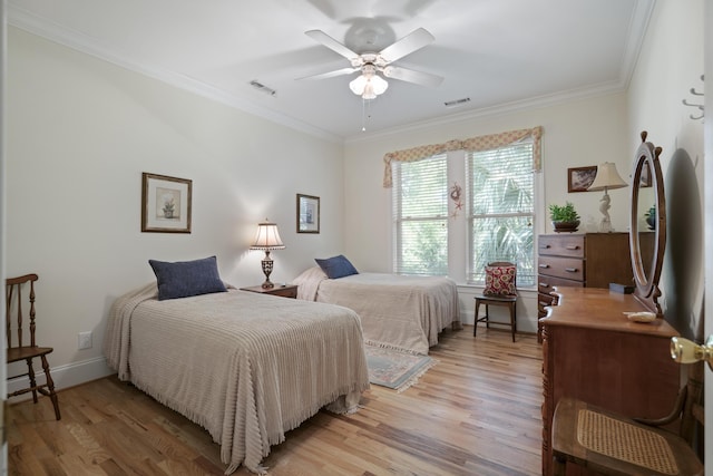 bedroom featuring light wood-type flooring, ceiling fan, and ornamental molding