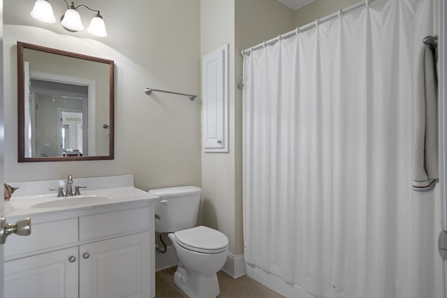 bathroom with vanity, toilet, and tile patterned floors