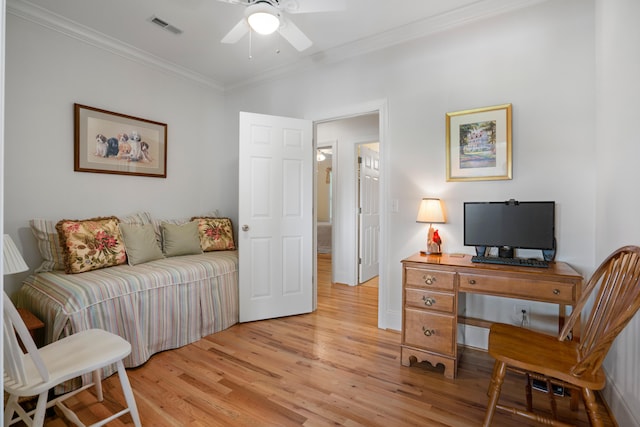 office with ceiling fan, light hardwood / wood-style flooring, and ornamental molding