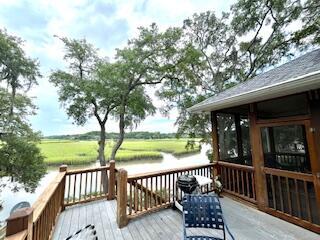 wooden terrace with a water view