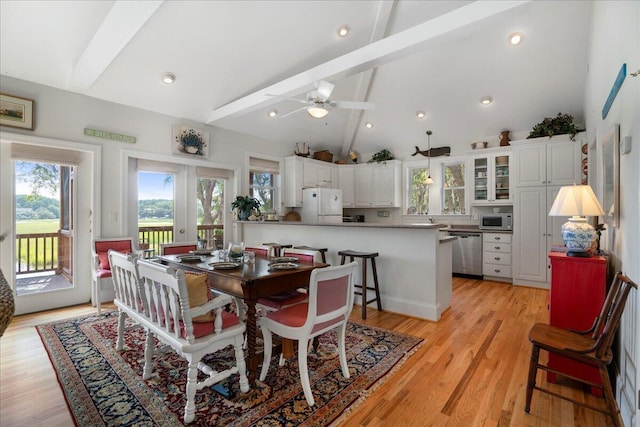 dining room with ceiling fan, french doors, high vaulted ceiling, light hardwood / wood-style floors, and beamed ceiling