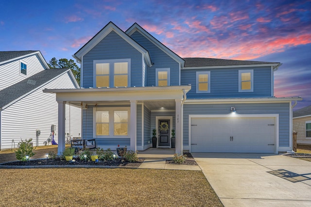 traditional-style home with a porch and driveway