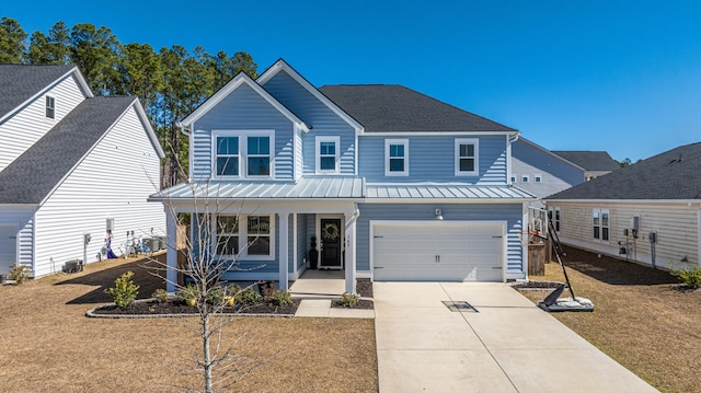 traditional-style home featuring a porch, cooling unit, a standing seam roof, and driveway