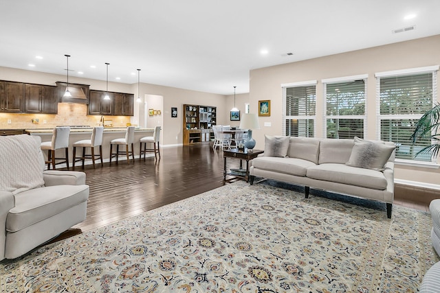 living room with dark wood-type flooring