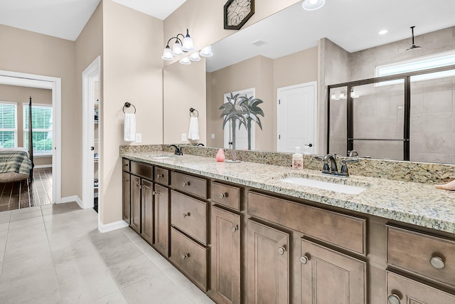 bathroom with an enclosed shower and vanity