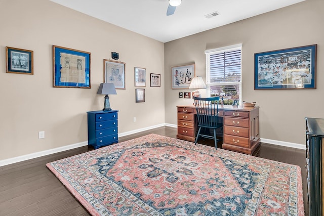 office area with ceiling fan and dark hardwood / wood-style flooring