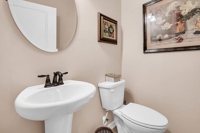 bathroom featuring sink and toilet