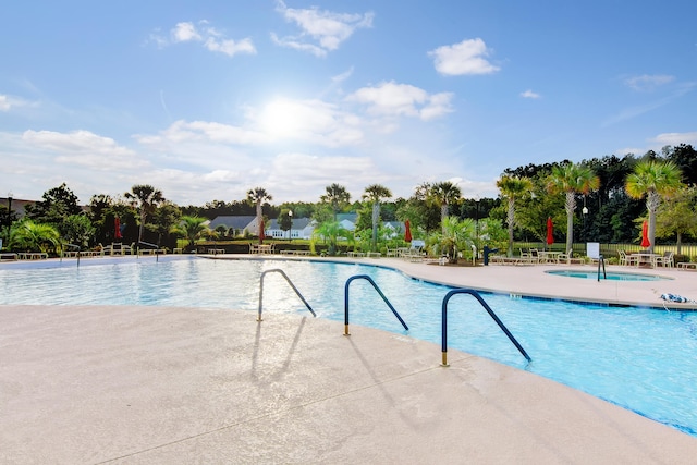 view of swimming pool with a patio