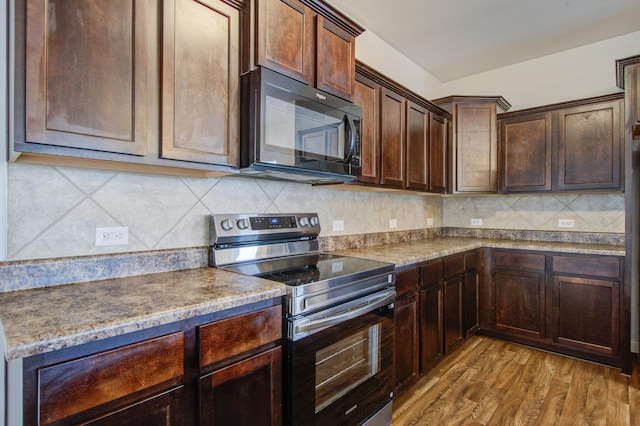 491 Fox Sparrow Ct, Summerville, SC 29486 - kitchen with dark brown cabinetry, black microwave, wood finished floors, stainless steel electric range, and decorative backsplash