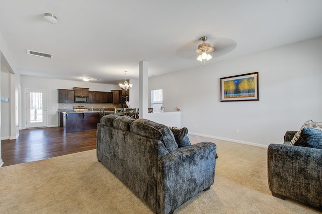 491 Fox Sparrow Ct, Summerville, SC 29486 - living area featuring carpet floors, ceiling fan with notable chandelier, baseboards, and visible vents