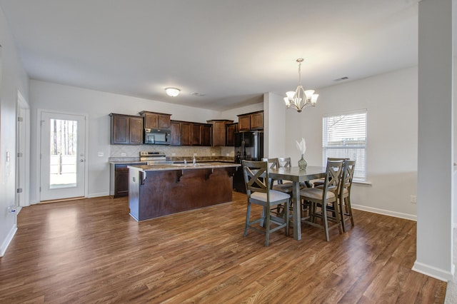 491 Fox Sparrow Ct, Summerville, SC 29486 - dining room featuring dark wood-style floors, a notable chandelier, visible vents, and baseboards