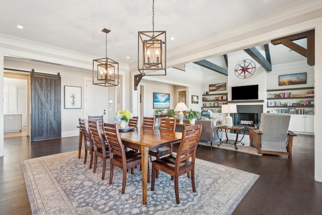 dining area with a fireplace, a barn door, recessed lighting, and dark wood-style floors