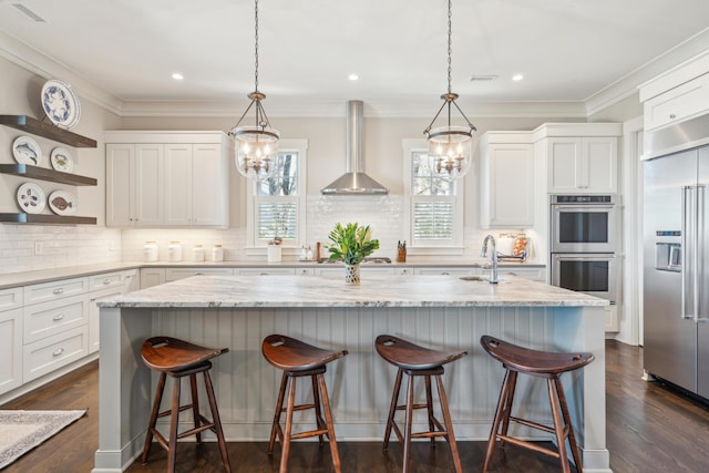 kitchen with visible vents, open shelves, appliances with stainless steel finishes, wall chimney exhaust hood, and white cabinets