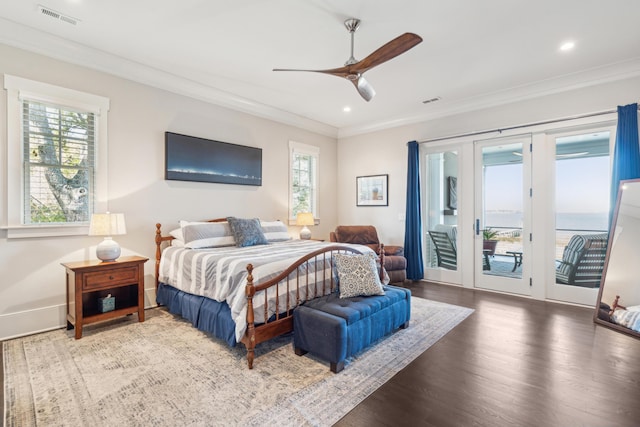 bedroom with access to exterior, visible vents, multiple windows, and crown molding