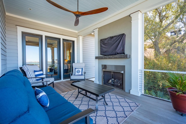 sunroom / solarium featuring a fireplace