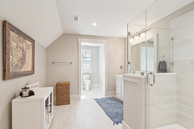 bathroom featuring visible vents, toilet, a stall shower, baseboards, and lofted ceiling