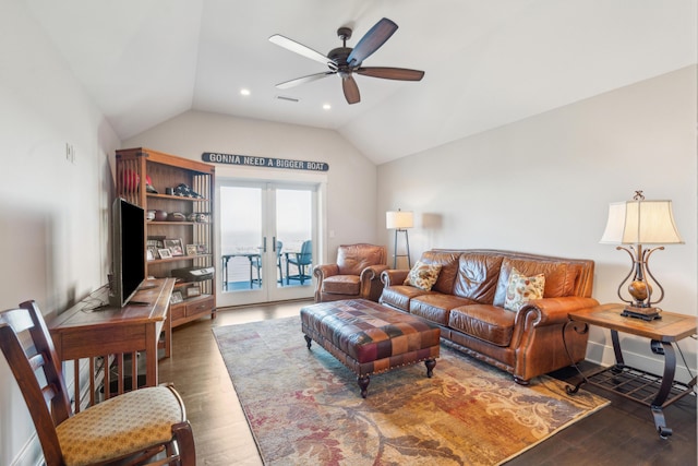 living room featuring visible vents, french doors, lofted ceiling, and wood finished floors