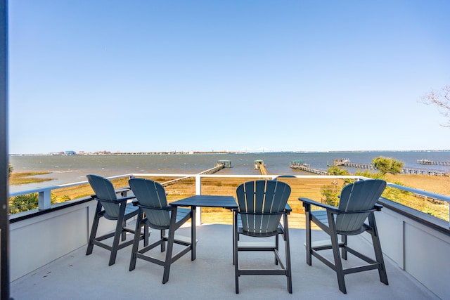 balcony featuring a water view