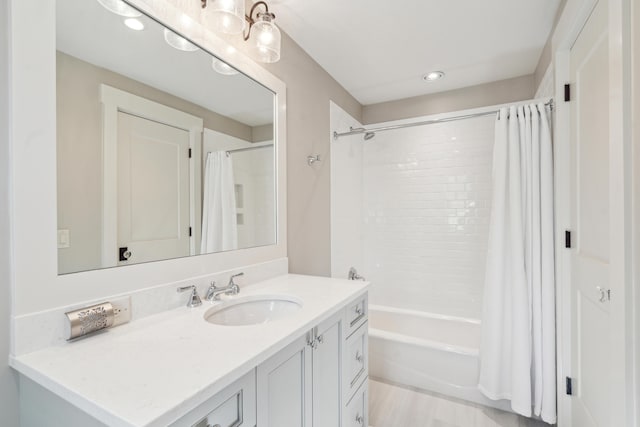 bathroom featuring vanity and shower / tub combo