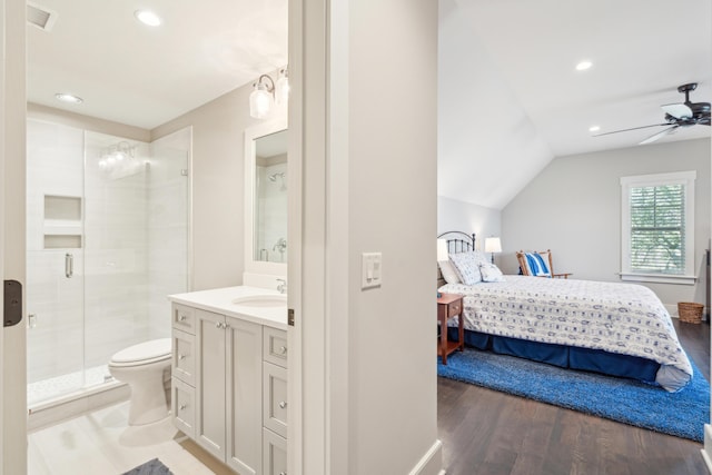 full bathroom featuring visible vents, a shower stall, vanity, wood finished floors, and ensuite bath