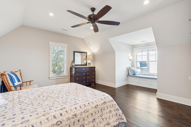 bedroom featuring multiple windows, dark wood-style floors, and vaulted ceiling