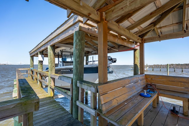 dock area featuring a water view and boat lift