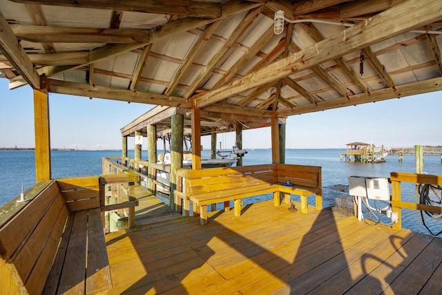 dock area with a water view and boat lift