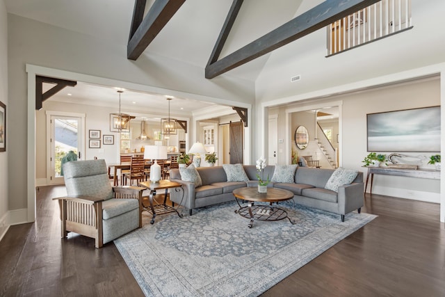 living room with stairway, beamed ceiling, dark wood-style floors, and an inviting chandelier