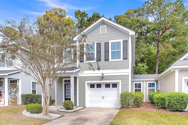 view of front property with a front lawn and a garage