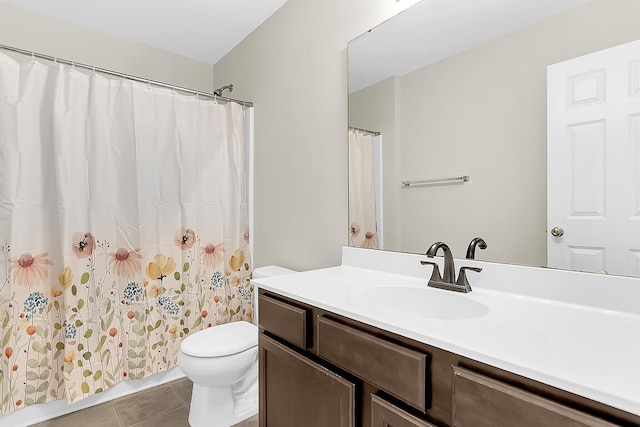 bathroom featuring vanity, curtained shower, toilet, and tile patterned flooring