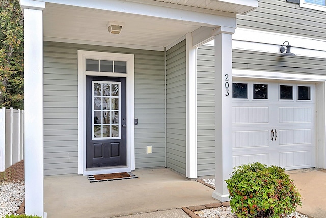 entrance to property featuring a garage