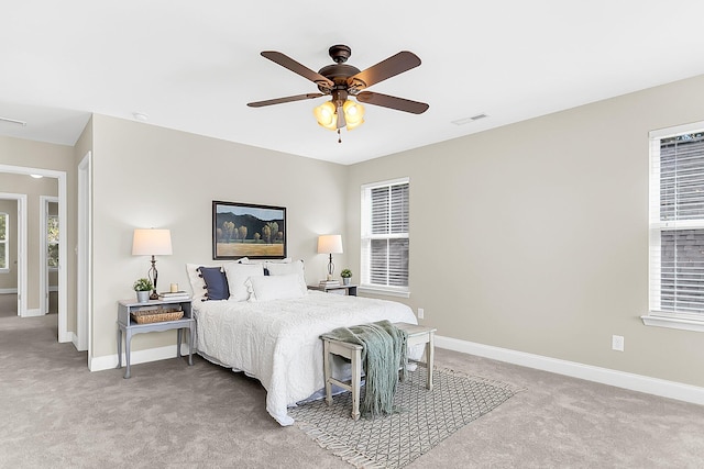 bedroom featuring ceiling fan and light colored carpet