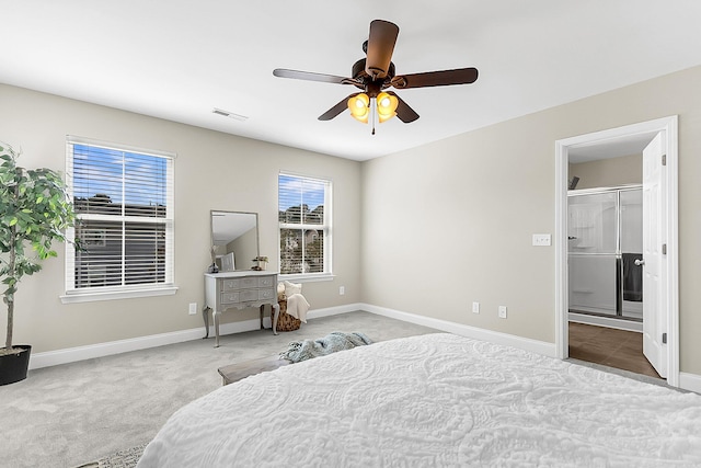 bedroom featuring ceiling fan, carpet flooring, and ensuite bathroom