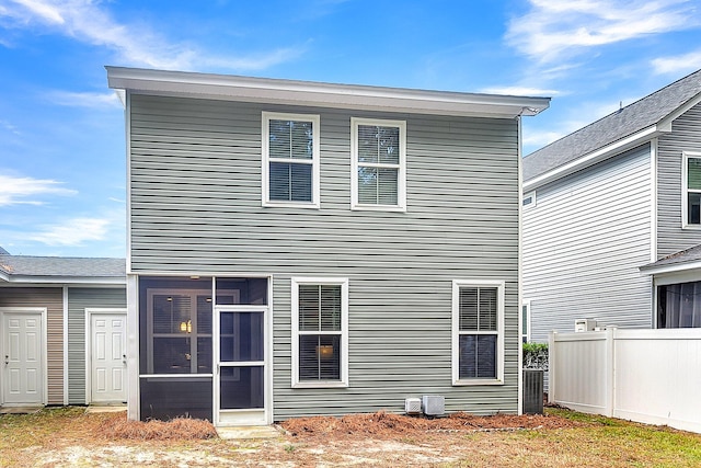 back of house featuring a sunroom