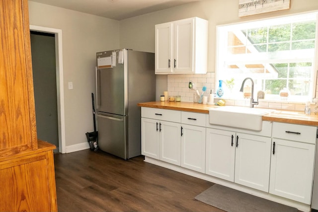 407 Tammie Ave, Goose Creek, SC 29445 - kitchen featuring freestanding refrigerator, wooden counters, decorative backsplash, and a sink